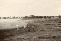 Four Men Standing in Field