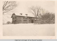 Frontal view of Grey house in winter