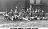 Cadets seated next to Armory, The University of Iowa, 1913