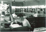Students in a reading room lounge in Hillcrest, the University of Iowa, 1950