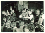 Fourth graders watching glass-blower, The University of Iowa elementary school,  May 11, 1939