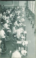 Dental students with patients in the infirmary clinic, The University of Iowa, 1940s