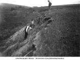George F. Kay, Frank Leverett, and Paul MacClintock in the field at the Nebraskan gumbotil outcrop 4 miles northeast of Ricketts, Iowa, July 1925