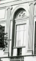 Bas relief panel over second floor end window of the original library building