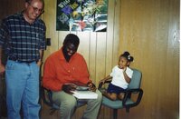2000  Larry Jones, J.B. Martin and Jaria<br />
looking at the Iowa Memorie's book 