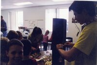 Students make pine cone bird feeders