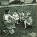 Woman reading to children outside, The University of Iowa, May 28, 1941