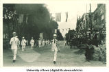 Burlington, Iowa marching band in parade, The University of Iowa, 1910s