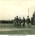 Group of soldiers walking on a field, The University of Iowa, 1950s