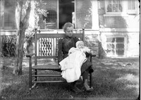 UP608 Woman and infant in rocker