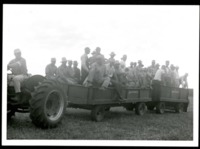 Tractor Pulls a Group of Soil Conservationists for a Site Visit 