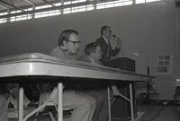 1976  Men at microphone 