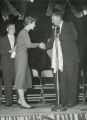 June Brandmill, homecoming queen and announcer at a Homecoming event, 1956