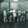 Dental students working with patients in a clinic, The University of Iowa, January 18, 1950