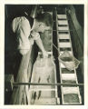 Engineering student working with fish in a hydraulic laboratory, The University of Iowa, 1939