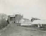 Carrie Chapman Catt Hall (Agricultural Hall) and greenhouses, 1919