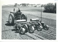 Melvin Manders on tractor, 1964