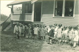 Children watering a garden patch, The University of Iowa, ca. 1920