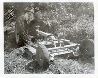 Unidentified Man on Tractor Mower Mows Lawn