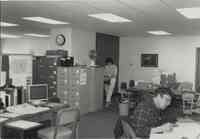 Office Photo with Woman at Filing Cabinet