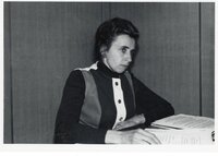 Unidentified woman reading papers