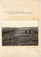 1937 - In a field, John Tebben talks to Superintendent Fred Larson of the Maquoketa CCC camp