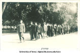 Cadet leading commencement procession, The University of Iowa, 1910s