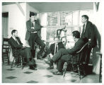 Edmund Keeley, Mark Strand, Vance Bourjaily, Paul Engle and R.V. Cassill in Writers' Workshop headquarters, The University of Iowa, 1960s