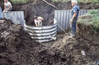 Installation of an aluminum drop spillway structure on the farm of Ken Carney.