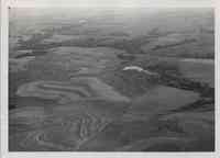 View of contoured farmland with pond in Plymouth County, Iowa