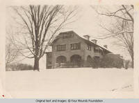 Grey house side entrance in winter