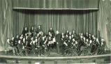 University orchestra with its conductor, Prof. Kendrie, The University of Iowa, 1920s