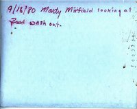 Marty Mirfield looking at pond washout, 1980