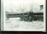Men surrounding a wagon holding boiler equipment outside, The University of Iowa, 1890s