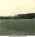 Soldiers marching near football field, The University of Iowa, 1950s