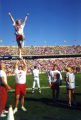 A cheerleader performing at  Homecoming, 1996