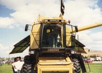 1997 District Conservationist J.B. Martin Sits in Caterpillar Combine at Ag Expo 1997