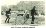 Cart carrying  baby King Tut in Mecca Day parade, The University of Iowa, 1923