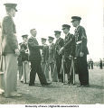 Man shaking hands with soldiers, The University of Iowa, 1950s