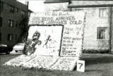 Homecoming lawn display of headlines announcing Cy's Berg Arrives; Stops Jayhawks Cold, 1977