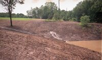 1970s Water runoff in field out of pipes