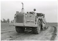 1979  Three views of man driving Caterpillar 613 earthmoving machine