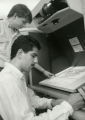 Students working with a microfilm reader, 1988