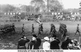 Governor's Day on Iowa Field, flag carried past Governor William L. Harding, The University of Iowa, May 12, 1917