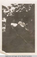 Man and a woman in buggy