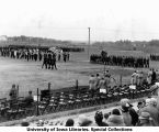 Governor's Day ceremony, cadets carrying American flag, The University of Iowa, 1929