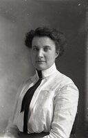 Woman standing with tie