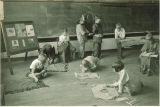First-graders making Native American costumes, The University of Iowa, February 1931