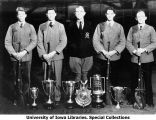 ROTC rifle team members with seven trophies, The University of Iowa, 1931