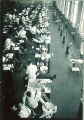 Dental students with patients in the infirmary clinic, The University of Iowa, 1940s